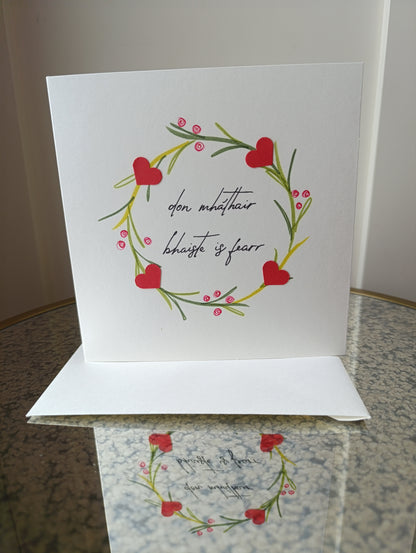 Greeting card with floral design and text on a surface